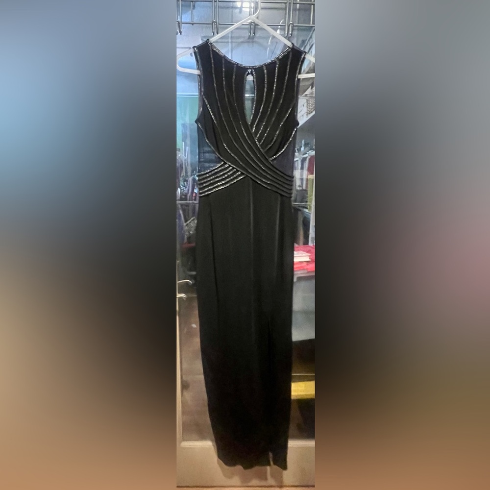 Tadashi sleeveless black gown w/graphite trim. Mesh back, knee high slit. sz SM.